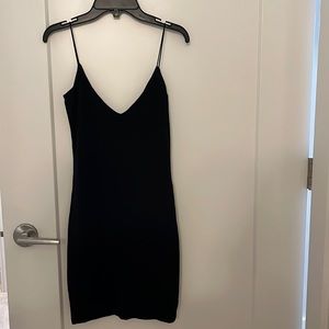 The perfect LBD by Wilfred. Black, mini, v neck and v back, spaghetti strap.
